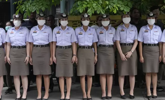 Nurse students pay respect to one of the victims of a school bus fire, at Police hospital in Bangkok, Thailand, Wednesday, Oct. 2, 2024. (AP Photo/Sakchai Lalit)