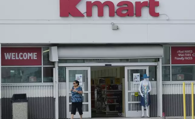 A customer exits the only Kmart store left in the continental United States, Tuesday, Oct. 22, 2024, in Miami. (AP Photo/Marta Lavandier)