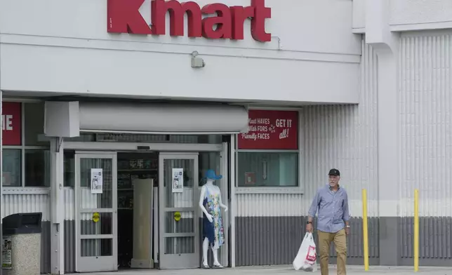 Juan de la Madriz exits the only Kmart store left in the continental United States with toys for his newborn grandson, Tuesday, Oct. 22, 2024, in Miami. (AP Photo/Marta Lavandier)