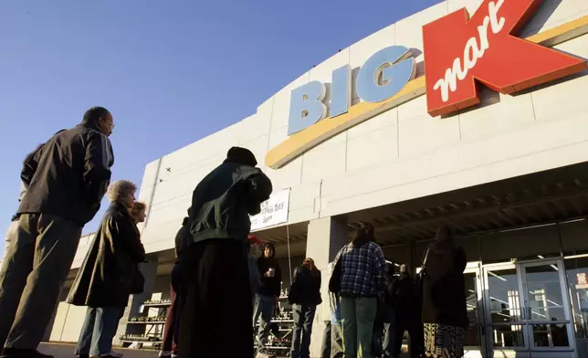 FILE - Shoppers wait outside a Kmart store for a 7 a.m. Thanksgiving Day sale in Nashville, Tenn., on Nov. 23, 2006. (AP Photo/Mark Humphrey, File)