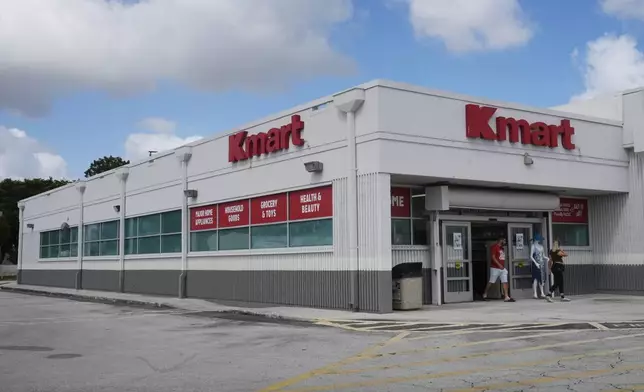 Customers leave from the only Kmart store left in the continental United States, Tuesday, Oct. 22, 2024, in Miami. (AP Photo/Marta Lavandier)