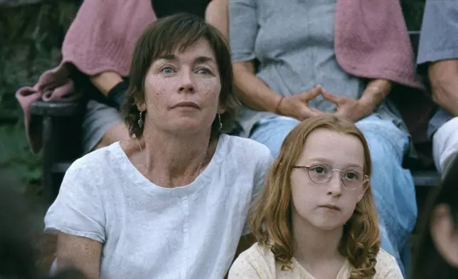 This image released by A24 shows Julianne Nicholson, left, and Zoe Ziegler in a scene from "Janet Planet." (A24 via AP)