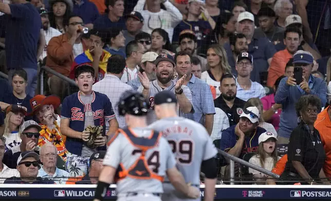 Detroit Tigers fans cheer starting pitcher Tarik Skubal (29) after the fourth inning of Game 1 of an AL Wild Card Series baseball game against the Houston Astros, Tuesday, Oct. 1, 2024, in Houston. (AP Photo/Kevin M. Cox)