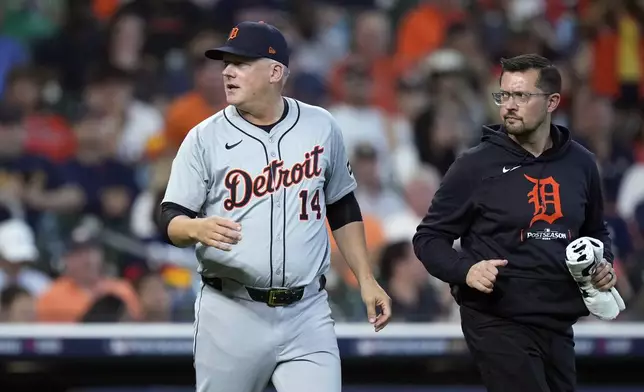 Detroit Tigers manager A.J. Hinch checks on starting pitcher Tarik Skubal during the sixth inning of Game 1 of an AL Wild Card Series baseball game against the Houston Astros, Tuesday, Oct. 1, 2024, in Houston. (AP Photo/Kevin M. Cox)