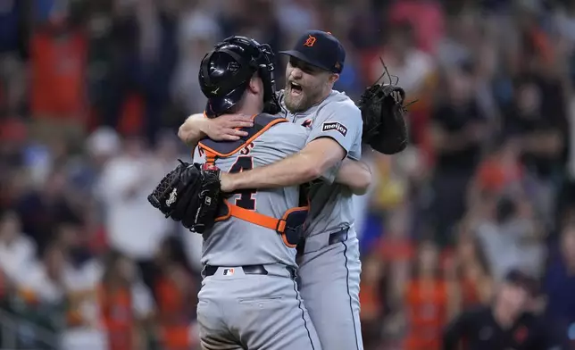 Detroit Tigers catcher Jake Rogers, left, and relief pitcher Will Vest, right, celebrate the team's 5-2 win against the Houston Astros in Game 2 of an AL Wild Card Series baseball game Wednesday, Oct. 2, 2024, in Houston. (AP Photo/Kevin M. Cox)