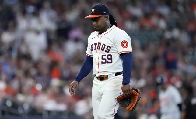 Houston Astros starting pitcher Framber Valdez walks to the dugout after being relieved during the fifth inning of Game 1 of an AL Wild Card Series baseball game against the Detroit Tigers, Tuesday, Oct. 1, 2024, in Houston. (AP Photo/Kevin M. Cox)