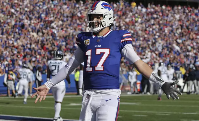 Buffalo Bills quarterback Josh Allen (17) celebrates a touchdown during the second half of an NFL football game against the Tennessee Titans, Sunday, Oct. 20, 2024, in Orchard Park, N.Y. (AP Photo/Jeffrey T. Barnes)