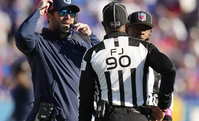 Tennessee Titans head coach Brian Callahan talks to officials during the second half of an NFL football game against the Buffalo Bills, Sunday, Oct. 20, 2024, in Orchard Park, N.Y. (AP Photo/Charles Krupa)