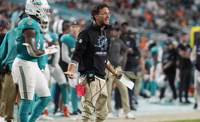 Miami Dolphins head coach Mike McDaniel gestures during the second half of an NFL football game against the Tennessee Titans, Monday, Sept. 30, 2024, in Miami Gardens, Fla. (AP Photo/Rebecca Blackwell)