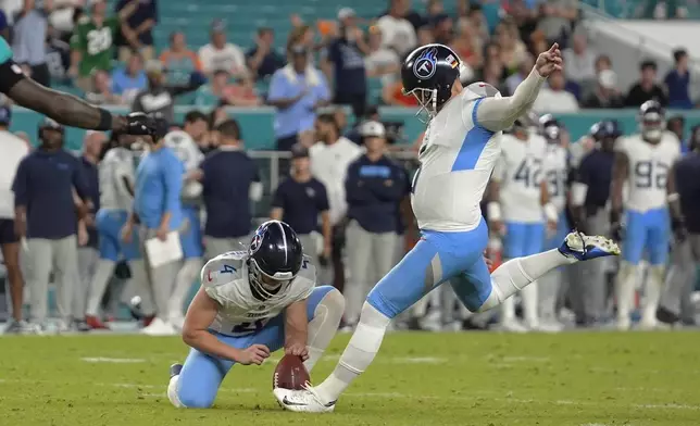 Tennessee Titans place kicker Nick Folk (6) kicks the extra point during the second half of an NFL football game against the Miami Dolphins, Monday, Sept. 30, 2024, in Miami Gardens, Fla. (AP Photo/Rebecca Blackwell)