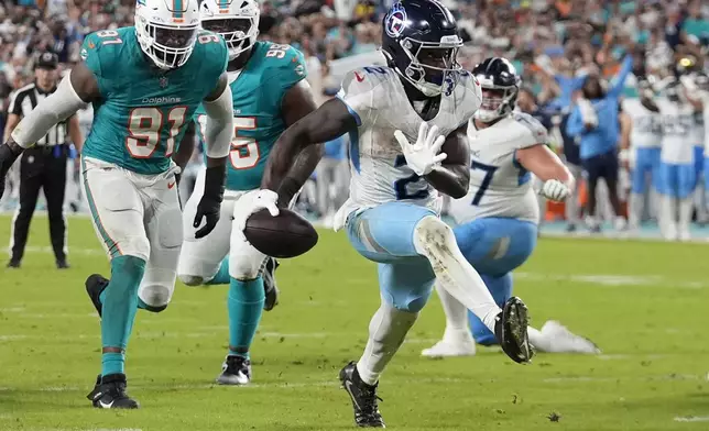 Tennessee Titans running back Tyjae Spears (2) runs for a touchdown during the second half of an NFL football game against the Miami Dolphins, Monday, Sept. 30, 2024, in Miami Gardens, Fla. (AP Photo/Rebecca Blackwell)