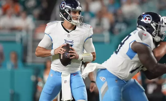 Tennessee Titans quarterback Mason Rudolph (11) aims a pass during the first half of an NFL football game against the Miami Dolphins, Monday, Sept. 30, 2024, in Miami Gardens, Fla. (AP Photo/Rebecca Blackwell)