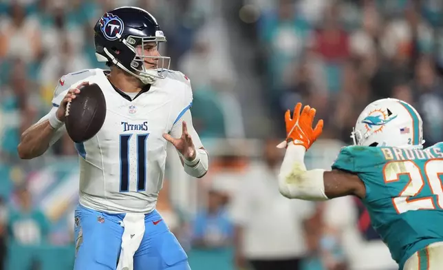 Tennessee Titans quarterback Mason Rudolph (11) aims a pass during the second half of an NFL football game against the Miami Dolphins, Monday, Sept. 30, 2024, in Miami Gardens, Fla. (AP Photo/Rebecca Blackwell)