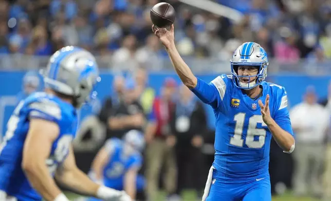 Detroit Lions quarterback Jared Goff (16) throws a pass during the second half of an NFL football game against the Tennessee Titans, Sunday, Oct. 27, 2024, in Detroit. (AP Photo/Carlos Osorio)