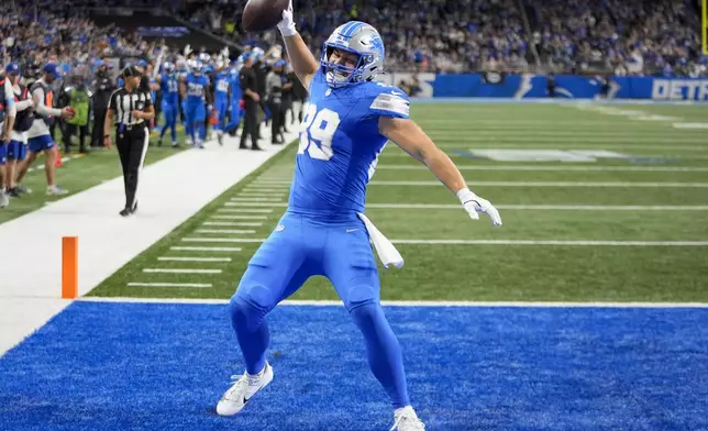 Detroit Lions tight end Brock Wright (89) celebrates his touchdown against the Tennessee Titans, during the first half of an NFL football game Sunday, Oct. 27, 2024, in Detroit. (AP Photo/Paul Sancya)