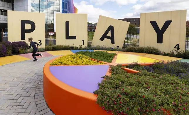 Large scrabble letters line the outdoor Hasbro Game Park at The Strong National Museum of Play, Tuesday, Oct. 15, 2024, in Rochester, N.Y. (AP Photo/Lauren Petracca)