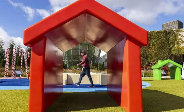 Oliver Jin of Toronto walks through the outdoor Hasbro Game Park at The Strong National Museum of Play, Tuesday, Oct. 15, 2024, in Rochester, N.Y. (AP Photo/Lauren Petracca)