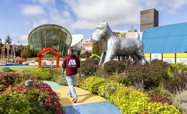 A visitor walks through the outdoor Hasbro Game Park at The Strong National Museum of Play, Tuesday, Oct. 15, 2024, in Rochester, N.Y. (AP Photo/Lauren Petracca)