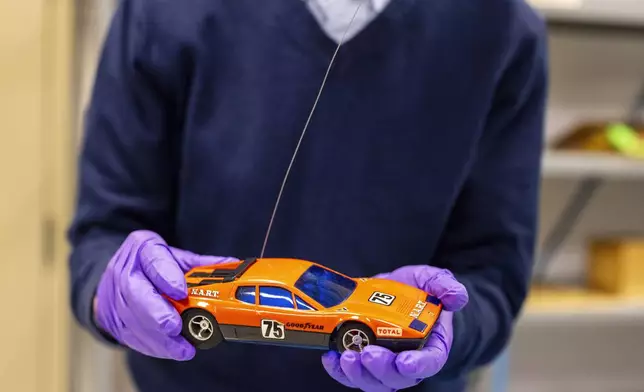 Christopher Bensch, chief curator at The Strong National Museum of Play, holds one of the toys that is a finalist for the 2024 Toy Hall of Fame, Tuesday, Oct. 15, 2024, in Rochester, N.Y. (AP Photo/Lauren Petracca)