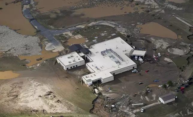 An aerial view of flood-damaged Unicoi County Hospital in the aftermath of Hurricane Helene, Saturday, Sept. 28, 2024, in Erwin, Tenn. (AP Photo/George Walker IV)