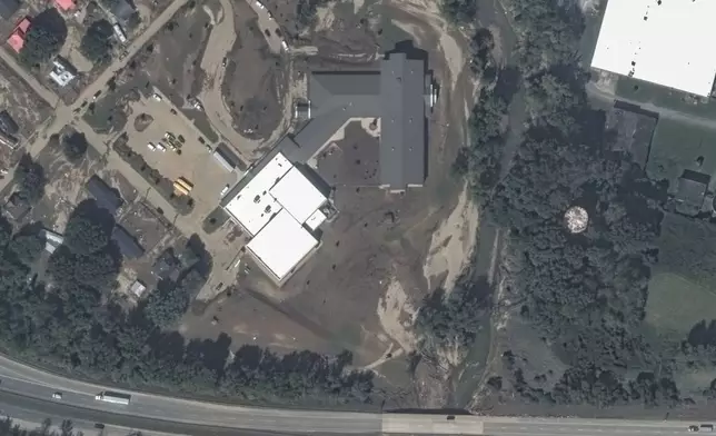 This satellite image released by Maxar Technologies shows mud and debris near Old Fort Elementary School, damage from Hurricane Helene in Old Fort, N.C., Wednesday, Oct. 2, 2024. (Satellite image ©2024 Maxar Technologies via AP)