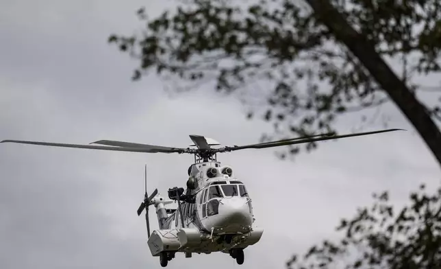 A medical helicopter takes off near downtown in the aftermath of Hurricane Helene, Monday, Sept. 30, 2024, in Asheville, N.C. (AP Photo/Mike Stewart)