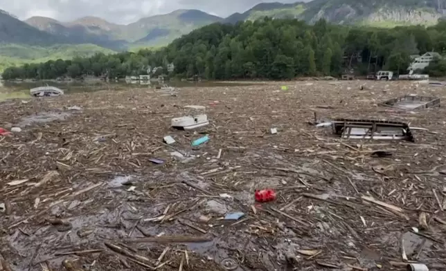 Flood debris from Hurricane Helene floats by in Rutherford County, N.C., Sunday, Sept. 29, 2024. (Tariq Bokhari via AP)