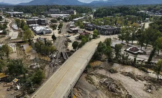 Debris is seen in the aftermath of Hurricane Helene, Monday, Sept. 30, 2024, in Asheville, N.C. (AP Photo/Mike Stewart)