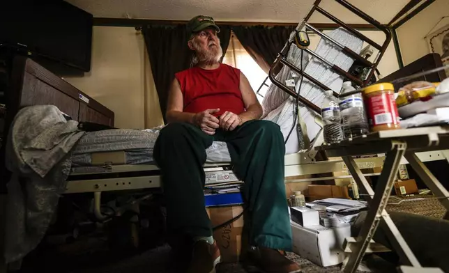 Cliff Stewart, who survived a flash flood whilst in a hospital bed, is seen in the aftermath of Hurricane Helene, Tuesday, Oct. 1, 2024, in Swannanoa, N.C. (AP Photo/Mike Stewart)