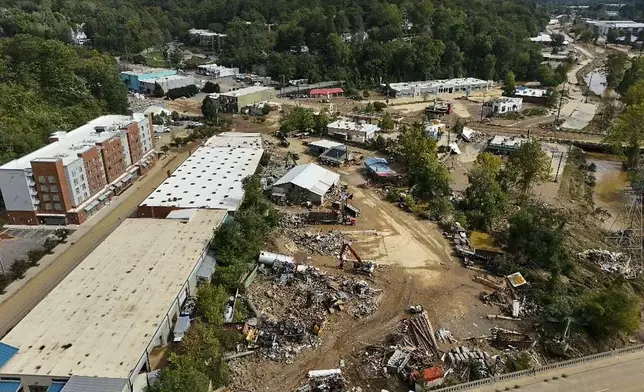 Debris is seen in the aftermath of Hurricane Helene, Monday, Sept. 30, 2024, in Asheville, N.C. (AP Photo/Mike Stewart)