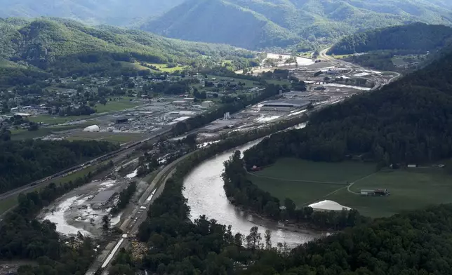 An aerial view of flood damage in the aftermath of Hurricane Helene, Saturday, Sept. 28, 2024, in Erwin, Tenn. (AP Photo/George Walker IV)