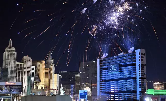 Fireworks are launched before the Tropicana Las Vegas towers are imploded, Wednesday, Oct. 9, 2024, in Las Vegas. (AP Photo/David Becker)