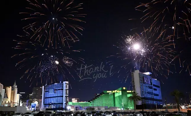 Fireworks are launched before the Tropicana Las Vegas towers are imploded Wednesday, Oct. 9, 2024, in Las Vegas. (AP Photo/David Becker)