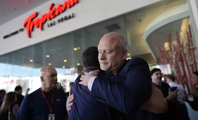 FILE - Tropicana general manager Airk Knowles, right, embraces an employee at the Tropicana hotel-casino after the property closed, Tuesday, April 2, 2024, slated for demolition in October to make room for a $1.5 billion baseball stadium, in Las Vegas. (AP Photo/John Locher, File)