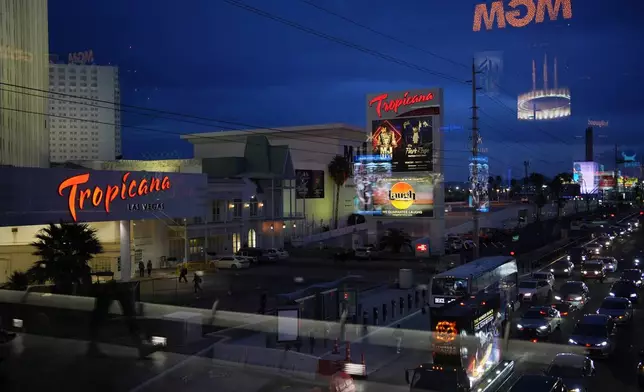 FILE - Cars drive by the Tropicana hotel-casino along the Las Vegas Strip, Thursday, March 28, 2024, in Las Vegas. (AP Photo/John Locher, File)