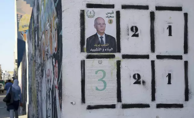 An election banner for Tunisian president and candidate for re-election Kais Saied pictured in Tunis ahead of the upcoming presidential elections, in Tunis, Tunisia, Thursday, Sept. 26, 2024. (AP Photo/Anis Mili)