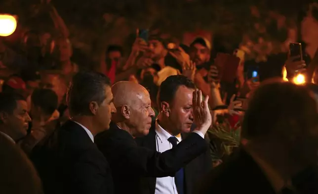 Tunisian president and candidate for re-election Kais Saied joins his supporters after the announcement of the provisional results for the presidential elections, in the capital Tunis, Tunisia, Sunday, Oct. 6, 2024. (AP Photo/Anis Mili)