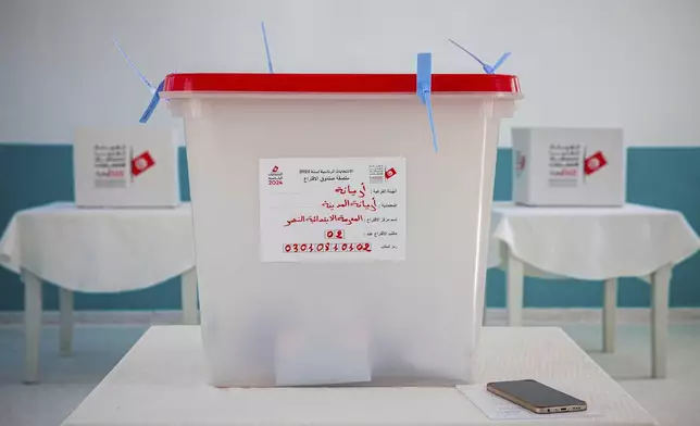 Ballot boxes inside a polling station during the presidential elections, in the capital Tunis, Tunisia, Sunday, Oct. 6, 2024 (AP Photo/Ons Abid)