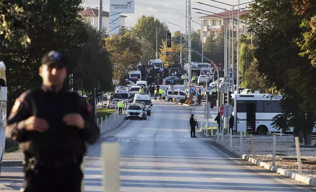 Emergency and security teams are deployed outside Turkish Aerospace Industries Inc. at the outskirts of Ankara, Turkey, Wednesday, Oct. 23, 2024. (Yavuz Ozden/Dia Photo via AP)