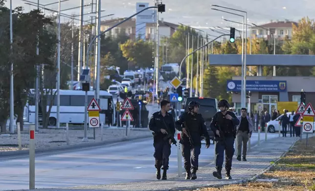 Emergency and security teams are deployed outside of Turkish Aerospace Industries Inc. at the outskirts of Ankara, Turkey, Wednesday, Oct. 23, 2024. (AP Photo)