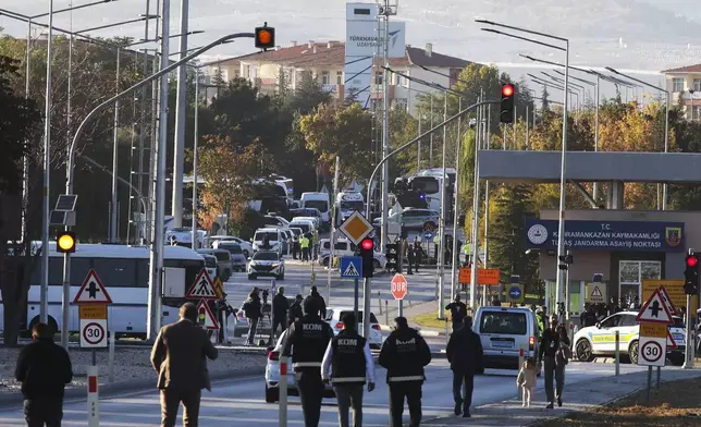 Emergency and security teams are deployed outside of Turkish Aerospace Industries Inc. at the outskirts of Ankara, Turkey, Wednesday, Oct. 23, 2024. (Yavuz Ozden/Dia Photo via AP)