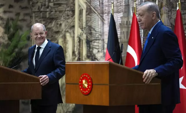 Turkey's President Recep Tayyip Erdogan, right, hold a press conference with Germany's Chancellor Olaf Scholz, in Istanbul, Turkey, Saturday, Oct. 19, 2024. (AP Photo/Khalil Hamra)