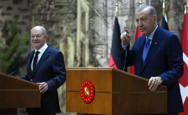 Turkey's President Recep Tayyip Erdogan, right, hold a press conference with Germany's Chancellor Olaf Scholz, in Istanbul, Turkey, Saturday, Oct. 19, 2024. (AP Photo/Khalil Hamra)