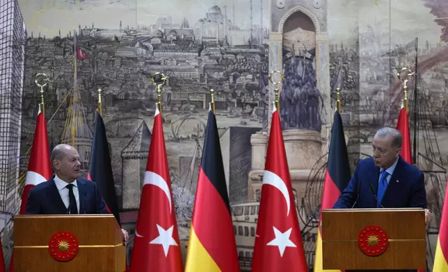 Turkey's President Recep Tayyip Erdogan, right, hold a press conference with Germany's Chancellor Olaf Scholz, in Istanbul, Turkey, Saturday, Oct. 19, 2024. (AP Photo/Khalil Hamra)