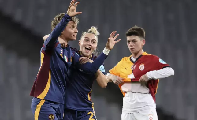 Roma's Valentina Giacinti, left, celebrates with teammate Giada Greggi after scoring their side's second goal during the women's Champions League group A soccer match between Galatasaray and Roma at Ataturk Olympic stadium in Istanbul, Turkey, Thursday, Oct. 17, 2024. (Huseyin Yavuz/Dia Photo via AP)