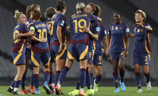 Roma's players celebrate after teammate Valentina Giacinti scored their side's second goal during the women's Champions League group A soccer match between Galatasaray and Roma at Ataturk Olympic stadium in Istanbul, Turkey, Thursday, Oct. 17, 2024. (Huseyin Yavuz/Dia Photo via AP)