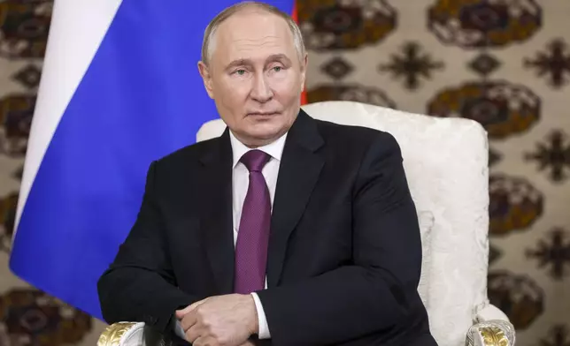 Russian President Vladimir Putin listens to Iranian President Masoud Pezeshkian during their meeting on the sidelines of the International Forum "The Interconnection of Times and Civilizations – the basis of peace and development" dedicated to the 300th anniversary of the birth of the outstanding Turkmen poet and thinker Magtymguly Fragi in Ashgabat, Turkmenistan, Friday, Oct. 11, 2024. (Alexander Shcherbak, Sputnik, Kremlin Pool Photo via AP)