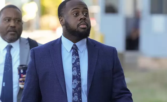 Tadarrius Bean, one of three former Memphis police officers charged in the 2023 fatal beating of Tyre Nichols, arrives at the federal courthouse for the day's proceedings Thursday, Oct. 3, 2024, in Memphis, Tenn. (AP Photo/George Walker IV)