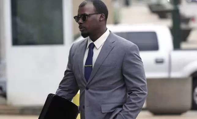 Justin Smith, one of three former Memphis police officers charged in the 2023 fatal beating of Tyre Nichol, arrives at the federal courthouse for the day's proceedings on Tuesday, Oct. 1, 2024, in Memphis, Tenn. (AP Photo/Karen Pulfer Focht)