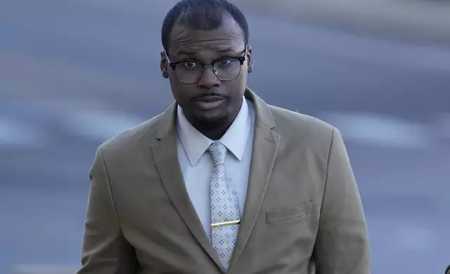 Justin Smith, one of three former Memphis police officers charged in the 2023 fatal beating of Tyre Nichols, arrives at the federal courthouse for the day's proceedings Thursday, Oct. 3, 2024, in Memphis, Tenn. (AP Photo/George Walker IV)